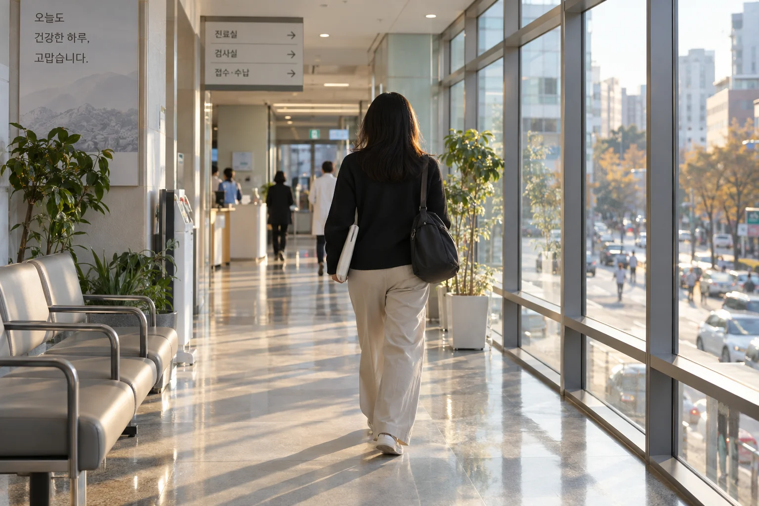 International patient leaving a Korean clinic with documents after completing an outpatient appointment